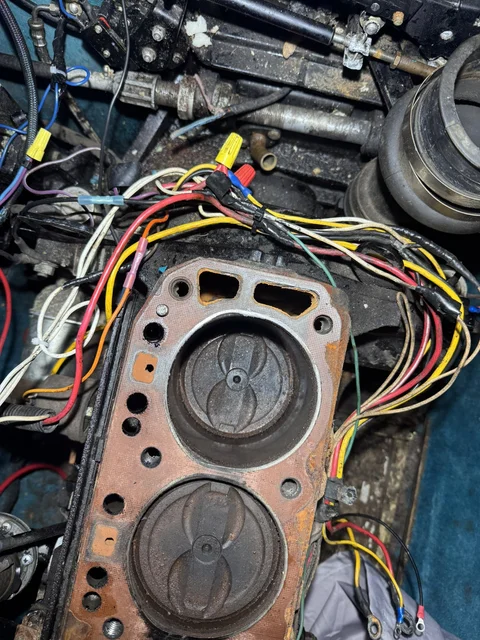 Some wiring repaired, trying to get the engine to start.  it was fruitless, compression is too low on Cyl 1 & 2.  I'll clean up the head and reassemble to see if we can get it to start.  IF that happens, I can burn out the rings to get them freed  up.