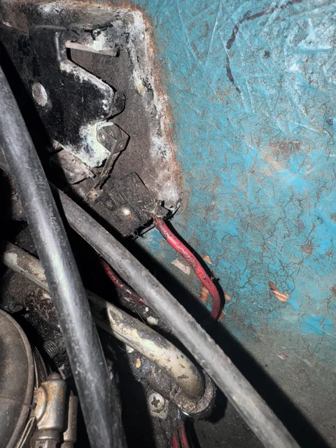 Funky Ignition/Neutral cutout switch.  When shifting from N to F or R, this little switch ungrounds the coil for a split second to lower the oil pressure ot get the gear cogs to go into place easier/quieter.