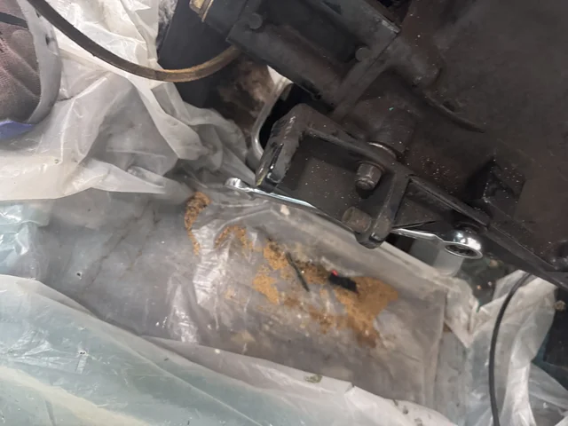 Sand from the manifold, not good.  Alternator is removed for upgrade :-)