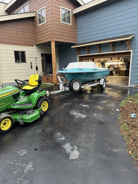 First hook up to the tractor after  heavy 2" reciever upgrade in front and rear to assist moving this bad boy around (this proved to be pivotal, I move it a lot :-))