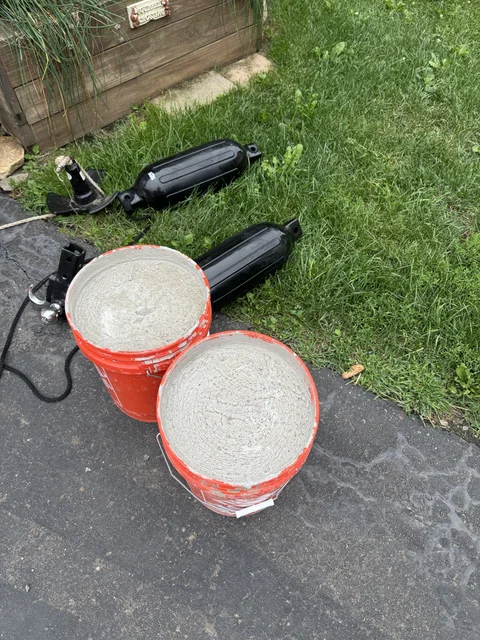 Home Depot cement mobile piers. Our local ordinance states I can’t make permanent piers. So.... I can take mine on a picnic 🤣. The shore is not even, of course.  The shore side of the dock basically sits on a loose rock wall on the shores edge, of which the rocks move and fall out, making the dock unsteady a bit.  I’m going to put these a bit back from shore, with cement pavers/shims for stability. Should allow me to set the dock on these (barely above ground level over shore a few inches), and then adjust level with shims rather than a large skipping stone and a softball sized rock to keep the peace between aluminum and earth :-)  We'll see how long the cement holds up.  Maybe my prototype can just stay in the water and I never have to worry about it again.
