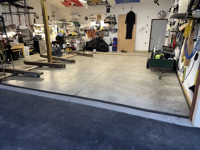 I don’t have a drain in this garage, so I’ll have to improvise. I created a sealed rubber lip “Picture frame”. The water all collects by the left side of the garage door. I have an automatic utility pump that will pump it automatically to the sink. 